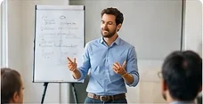 Presenter speaking beside a flipchart